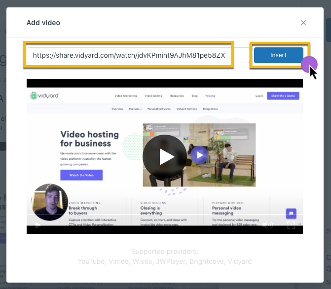 Pasting the sharing page URL of your video into the field to embed a video on your article